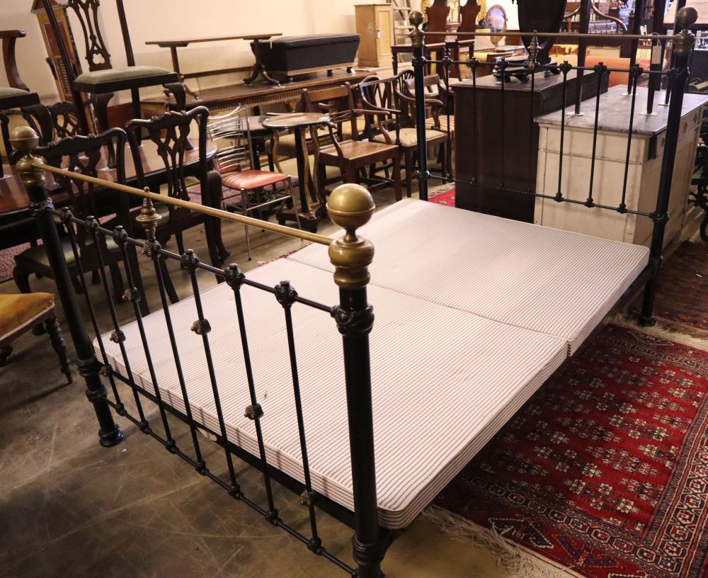 A Victorian style metal and brass double bed frame, width 140cm